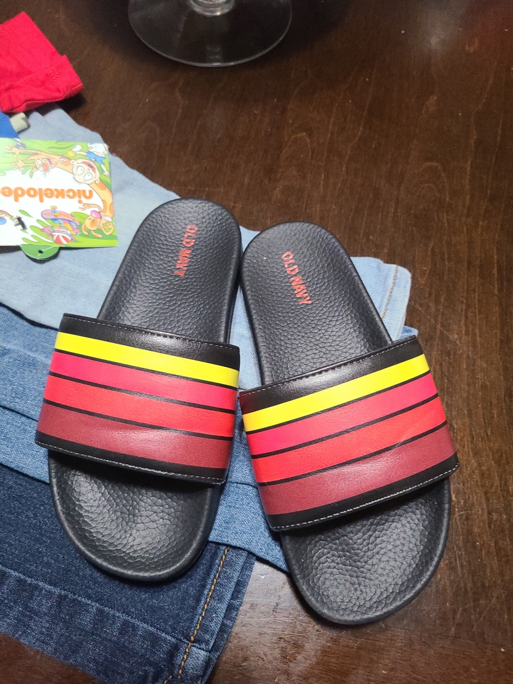 Old Navy Black Slides with Red and Yellow Stripes